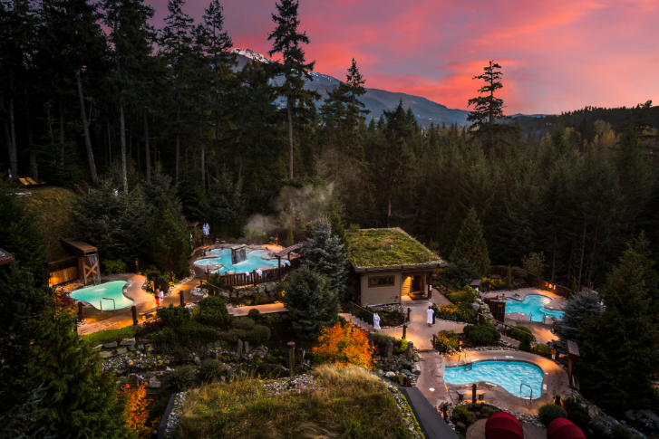 the hot mineral pools and cold pools at the Scandinave Spa in Whistler at sunset