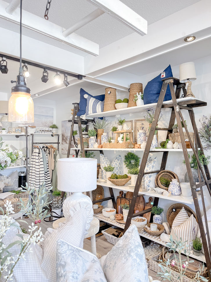 home decors of lamps, ceramics, baskets, pillows and potted fake plants inside a home decor shop