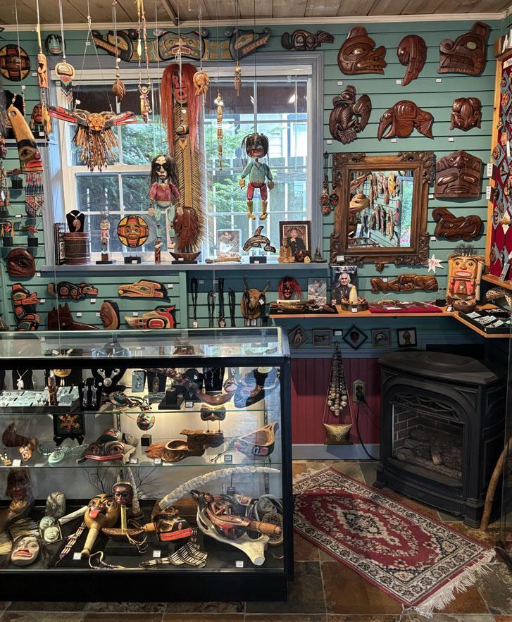 carvings shop studio with lots of wooden carvings and artifacts