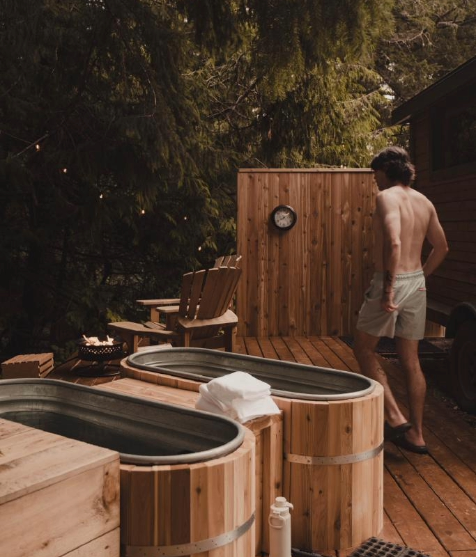 A person takes in the cold plunge experience at Wildwood saunas in Victoria