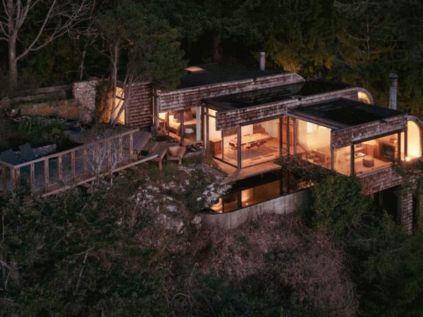 aerial view of a lit west coast modern two-bedroom, two-bathroom home property