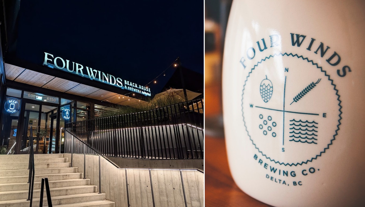 a lit building with a sign that says "Four Winds Beach House & Brewery ' on the front side of the roof and an image of a container that says 'Four Winds Brewing Co., Delta, BC'