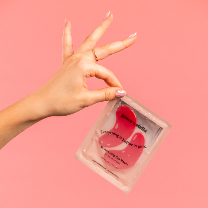 person holding eye masks from Grace & Stella