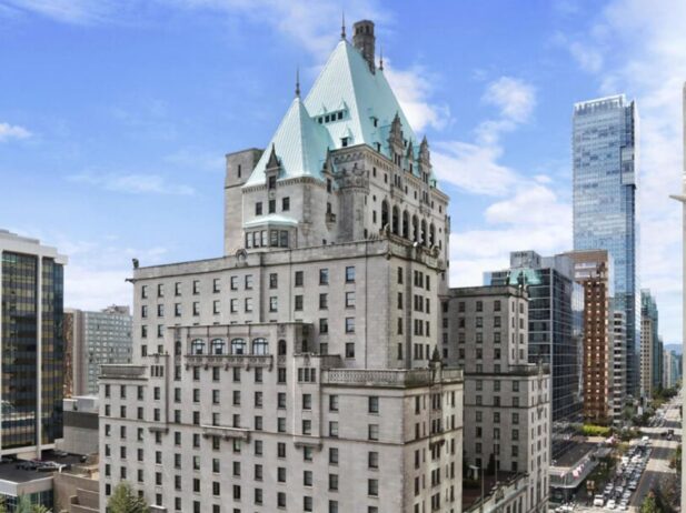 a huge and vast castle building - the fairmont hotel vancouver