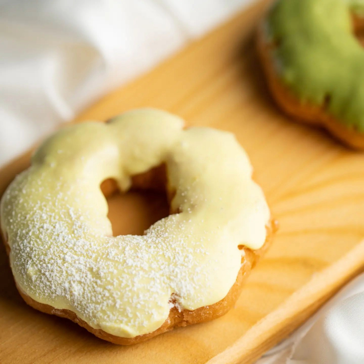 a pale yellow glazed mochi donut from Holy Mochi Donuts