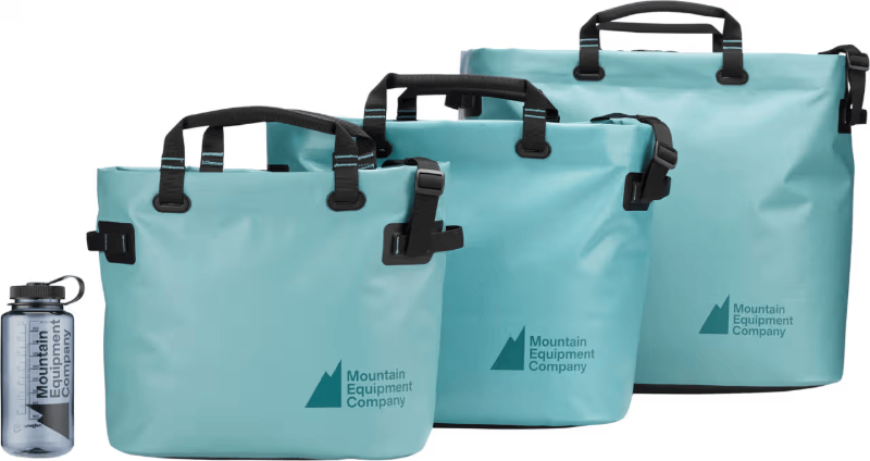 blue MEC dry tote bags lined up in a row 
