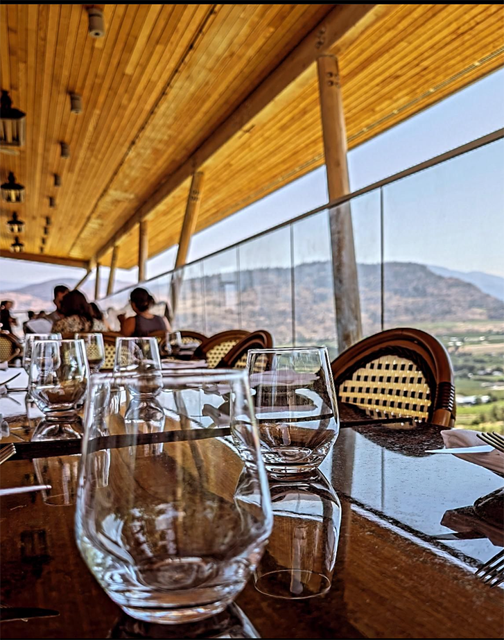 A restaurant patio with a view of the Okanagan