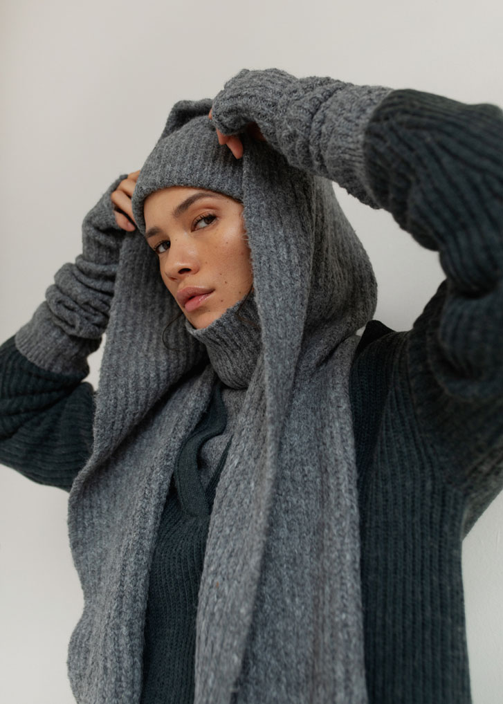 woman wearing cold clothing with a grey hood scarf