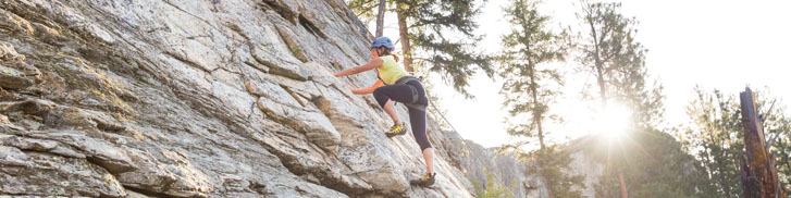 a woman rock-climbling 