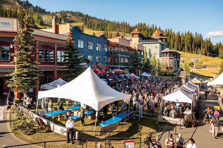 large and small canopies with huge crowds around