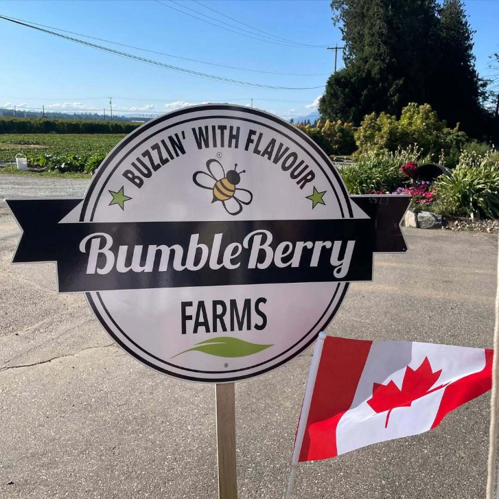Bumbleberry Farms sign with a Canadian flag