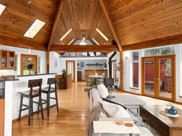 interior of cedar island coastal home with a dining, living room space and kitchen space