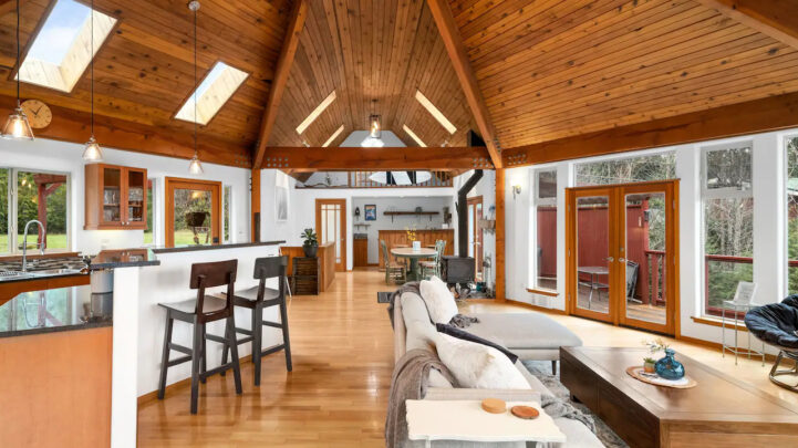 interior of cedar island coastal home with a dining, living room space and kitchen space