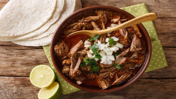 beef stew in bowl and white taco wraps on the table