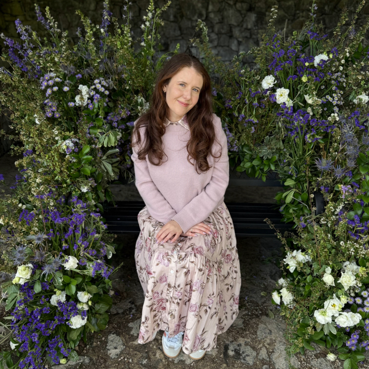 Lyndi Barrett posing around flowers