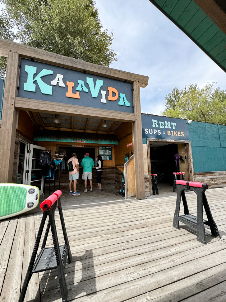 a surf shop with the words 'Kalavida' written at the top of the shop face