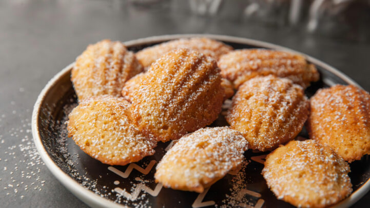 Madeleines topped with powdered sugar