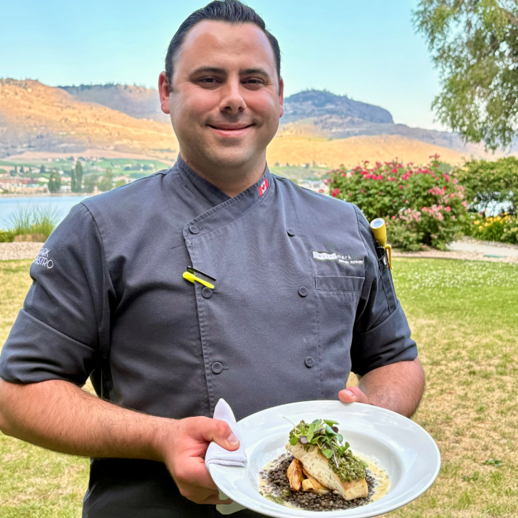 Chef holding the Pacific halibut dinner at 15 Park Bistro 